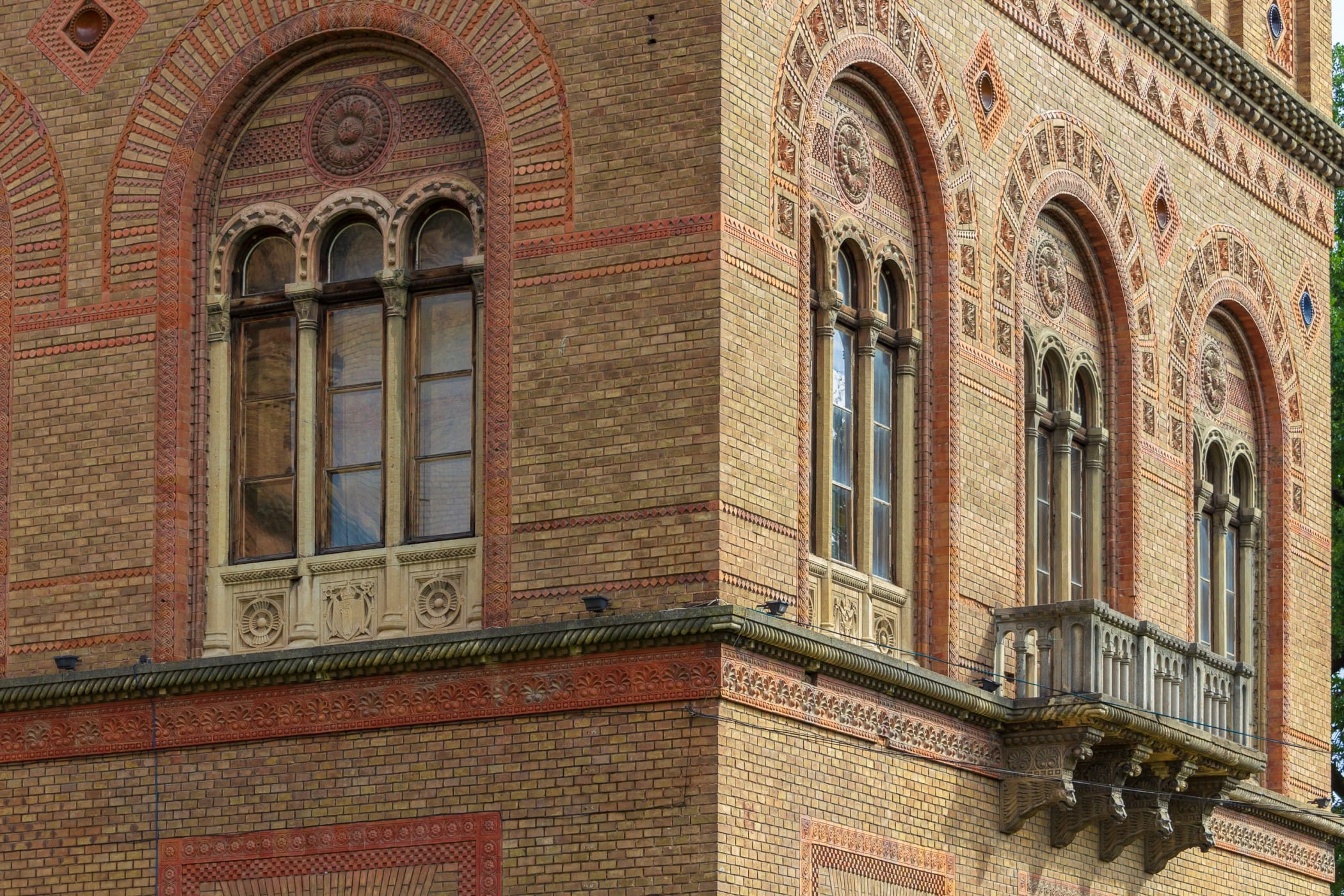 ornate-brick-building-with-arched-windows-and-balc-2026-03-26-06-13-37-utc restoration windows